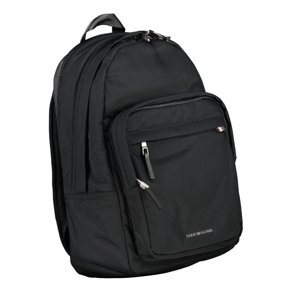 Tommy Hilfiger Black Polyester Backpack with handle, adjustable straps, external pockets, laptop compartment, and logo detailing.