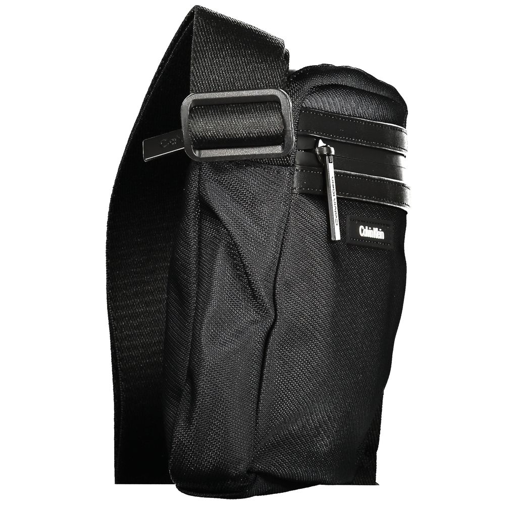Calvin Klein Black Polyester Men Shoulder Bag with adjustable straps, external pockets, and zip closure, stylish and functional design.