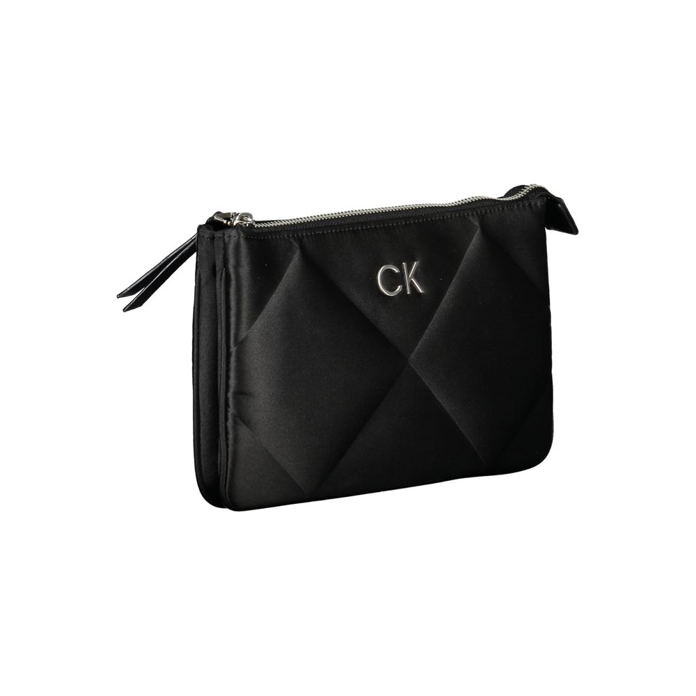 Calvin Klein Black Polyester Handbag with adjustable shoulder strap, 2 compartments, card pocket, zip closure, and CK logo.