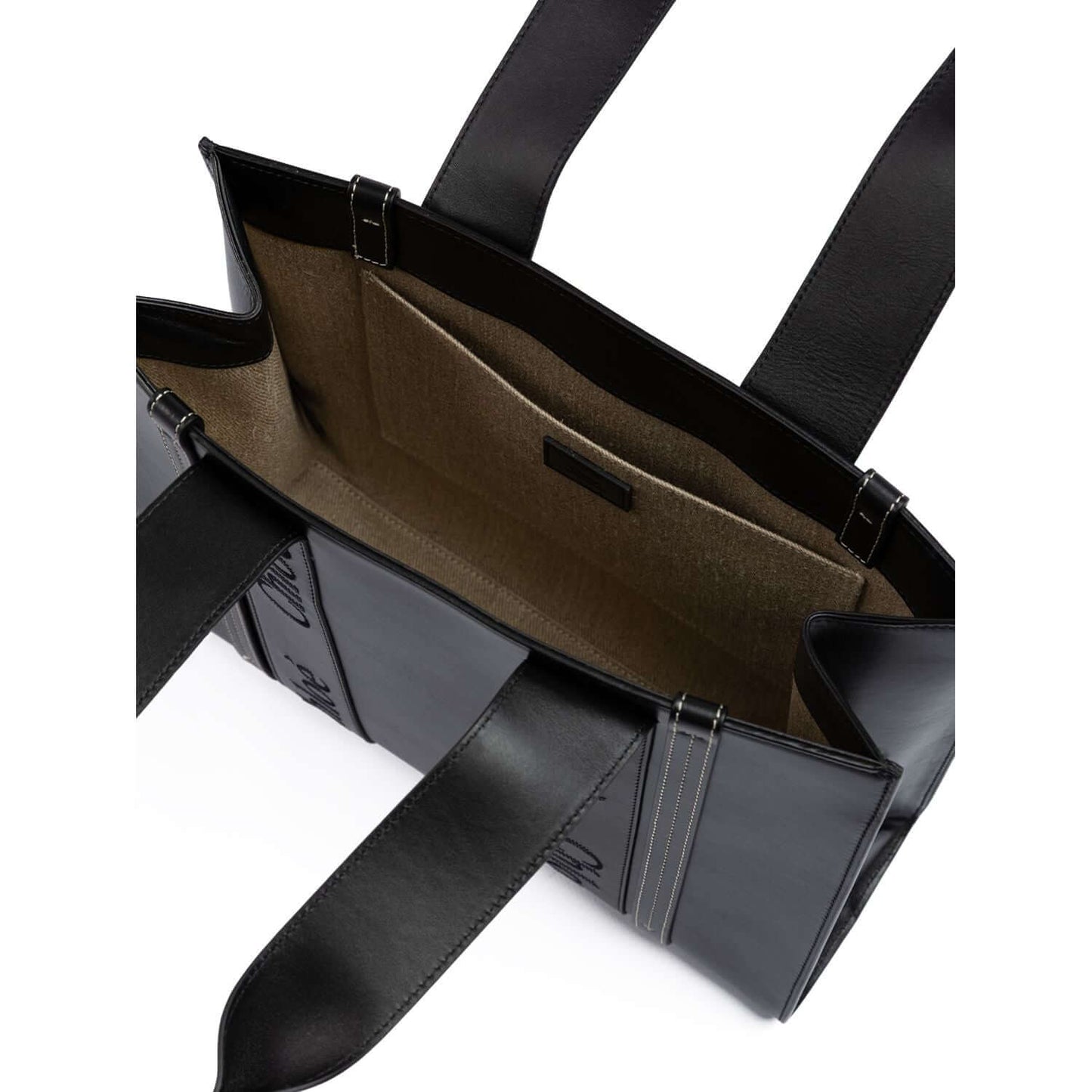 Interior view of Chloé Black Woody Embroidered Logo Leather Medium Tote Bag with open top and spacious interior pockets.