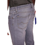 Jacob Cohen Sleek Slim Fit Grey Denim jeans with golden stitching and leather patch, featuring classic five-pocket design.
