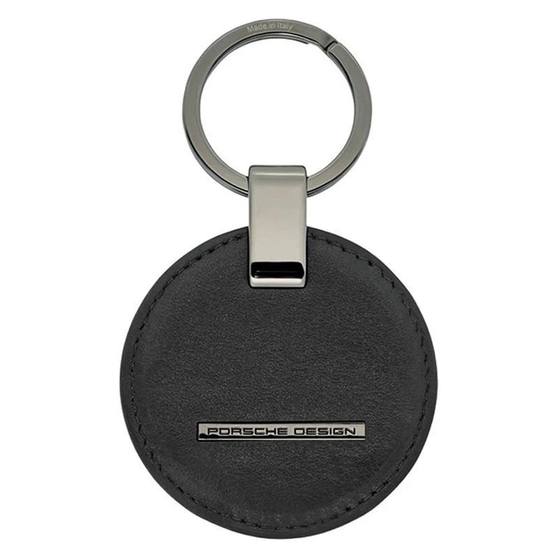 PORSCHE PORTACHIAVI MOD. OKY08802-001 sleek black round keychain with metallic accents, featuring Porsche Design logo for luxury appeal.