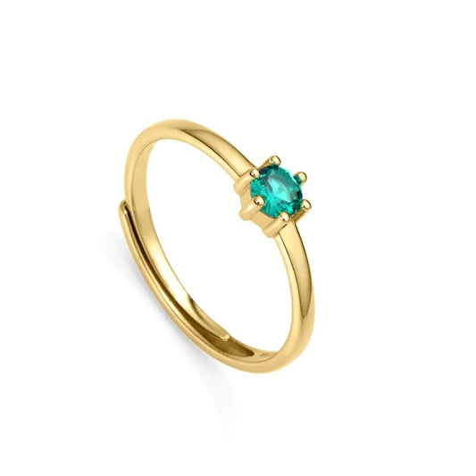 Elegant gold ring with teal gemstone on white background