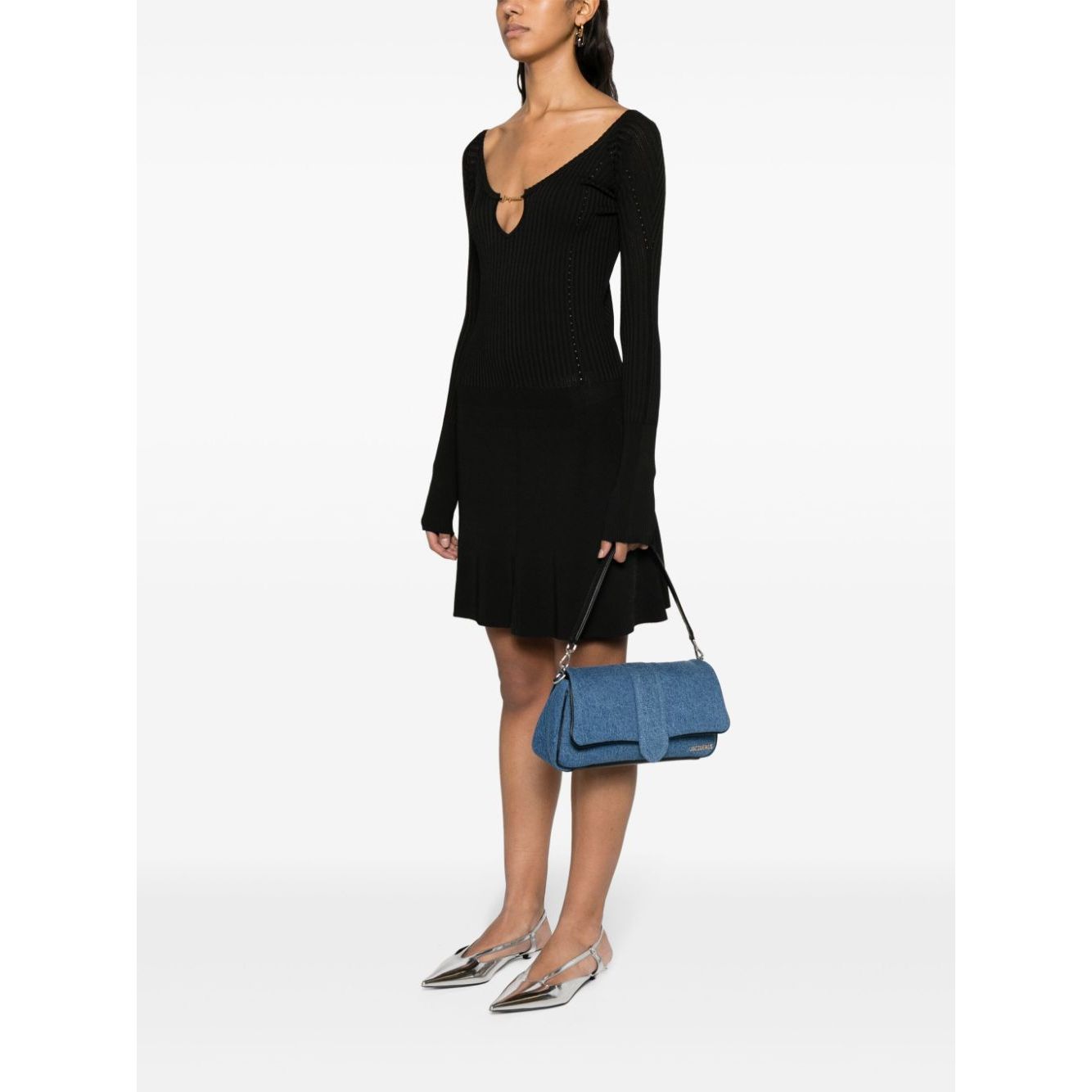 JACQUEMUS Dresses Black mini robe with ribbed knit, flared skirt, wide neck, and scallop hem, shown on model with blue handbag.
