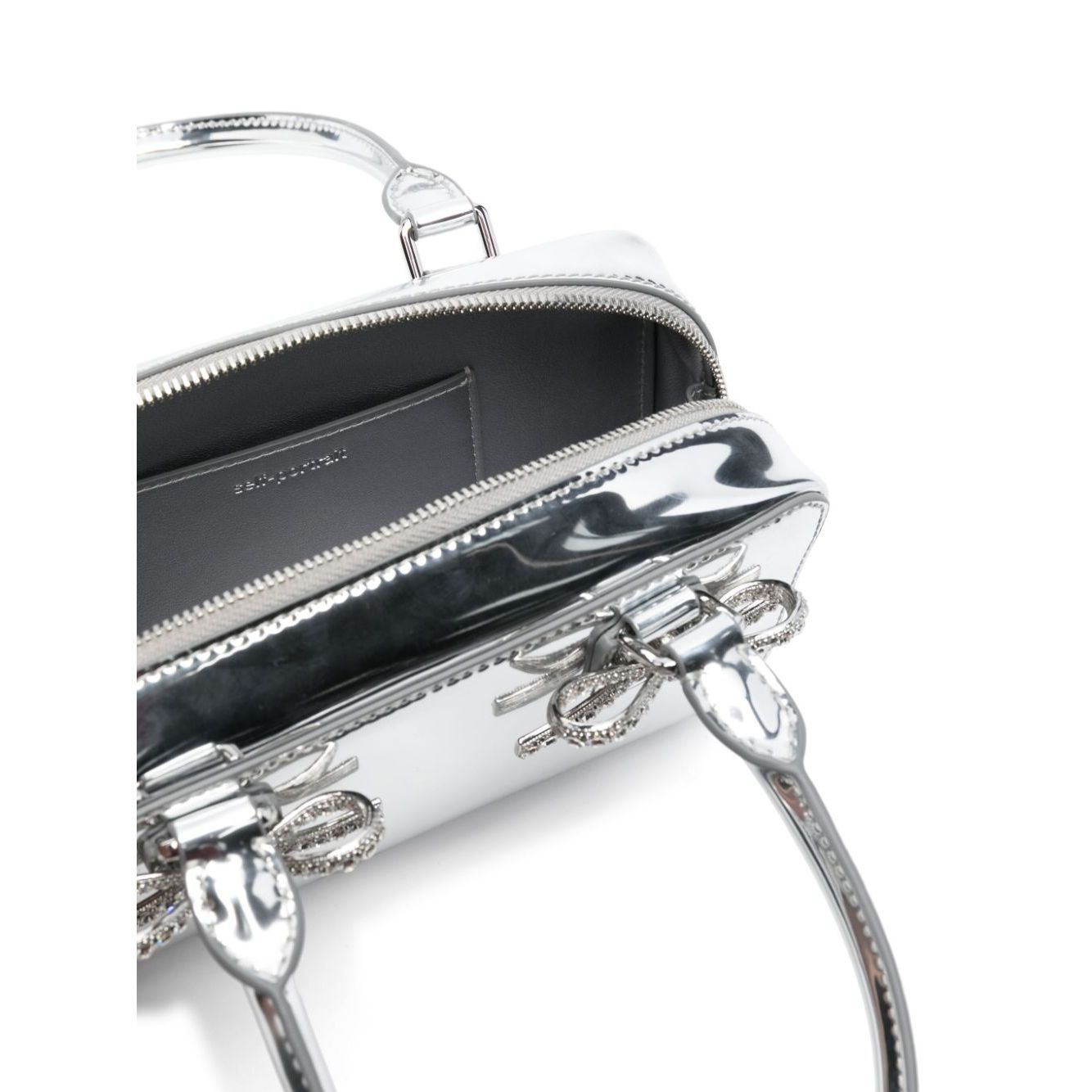 Front view with bag zipped and handles upright.