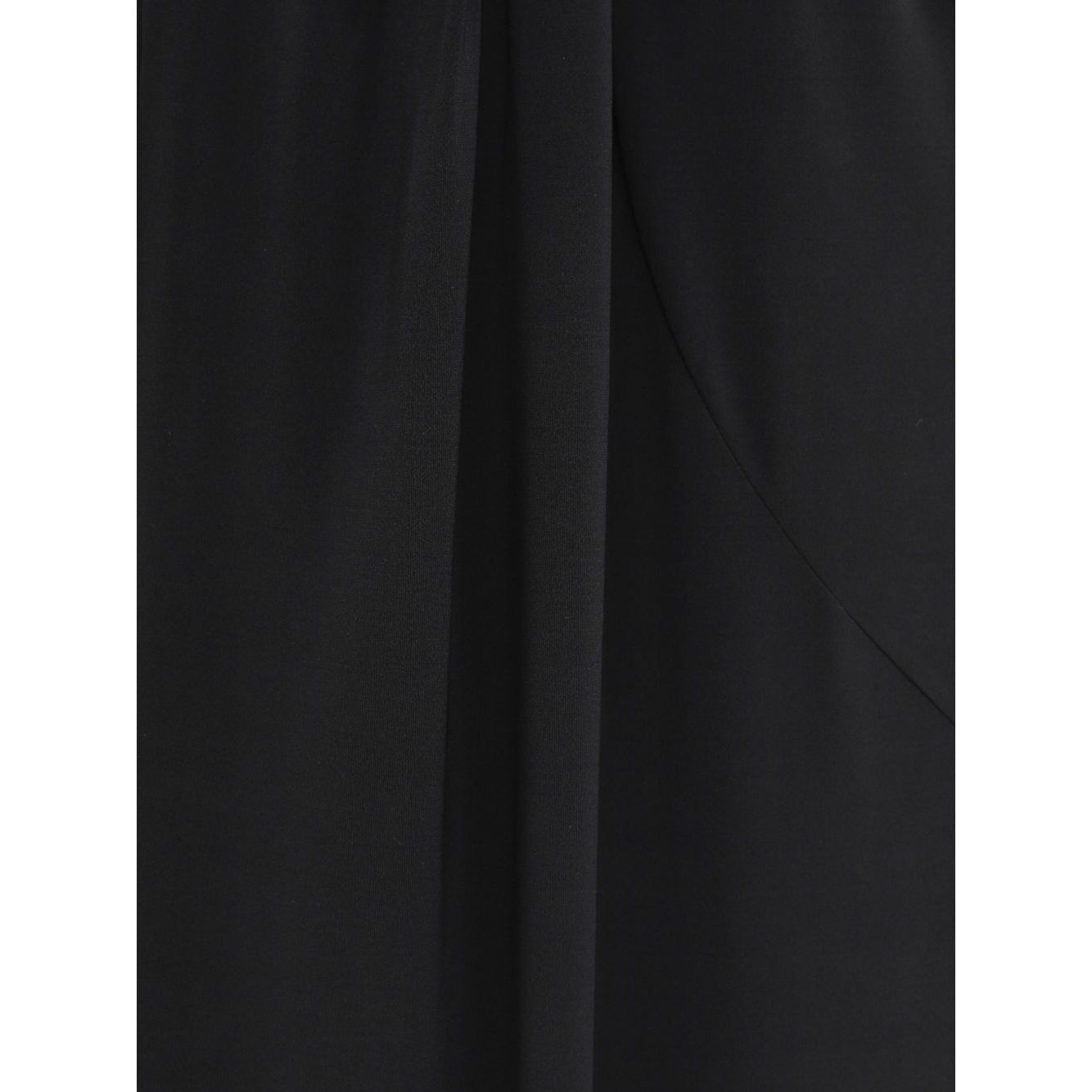 Close-up of black JACQUEMUS Skirts with high waist, front slit, pleat detail, and rear zip fastening.