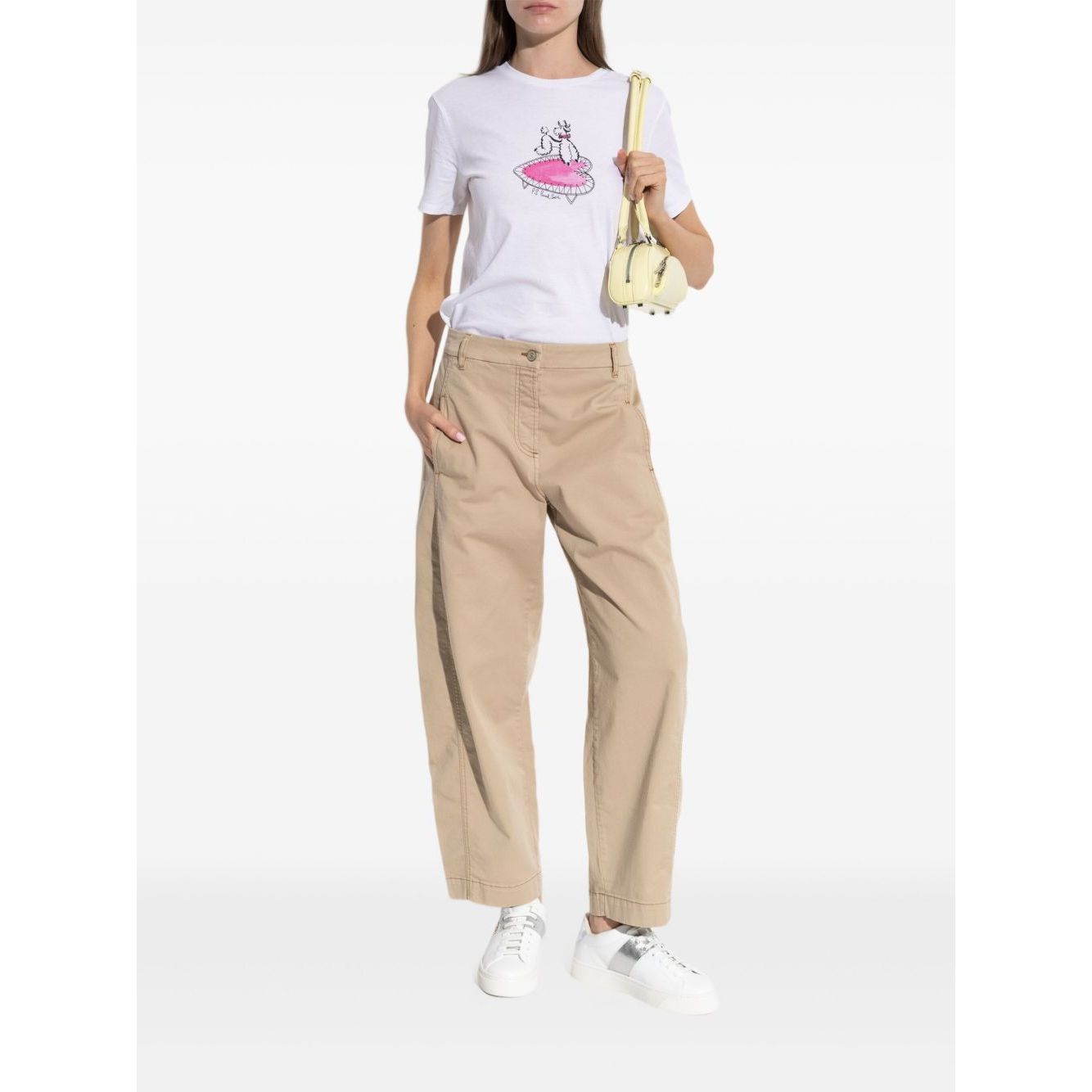 Woman wearing PS By Paul Smith T-shirts and Polos White, organic cotton t-shirt with poodle print, paired with beige pants and white sneakers.