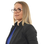 Woman wearing Ted Baker Brown Women Glasses Frame, cat eye style with full-rim acetate in brown, shown with a professional outfit.
