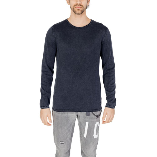 Man wearing Jack Jones Blue Cotton Sportswear knit sweater with crew neck and long sleeves, showcasing casual refined look.