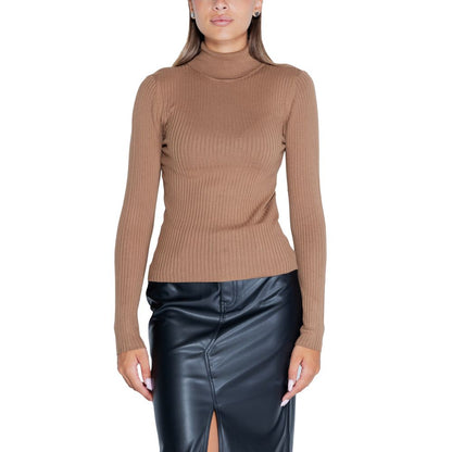 Woman wearing Jacqueline De Yong Brown Viscose Sweatshirt with roll neck and long sleeves, paired with black skirt for a chic look.