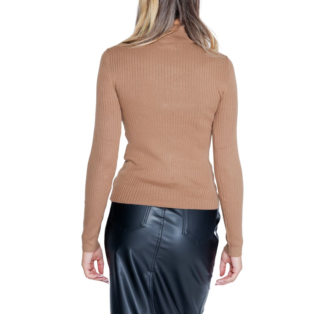 Back view of Jacqueline De Yong Brown Viscose Sweatshirt with roll neck and long sleeves, paired with a black leather skirt.