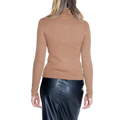 Back view of Jacqueline De Yong Brown Viscose Sweatshirt with roll neck and long sleeves, paired with a black leather skirt.