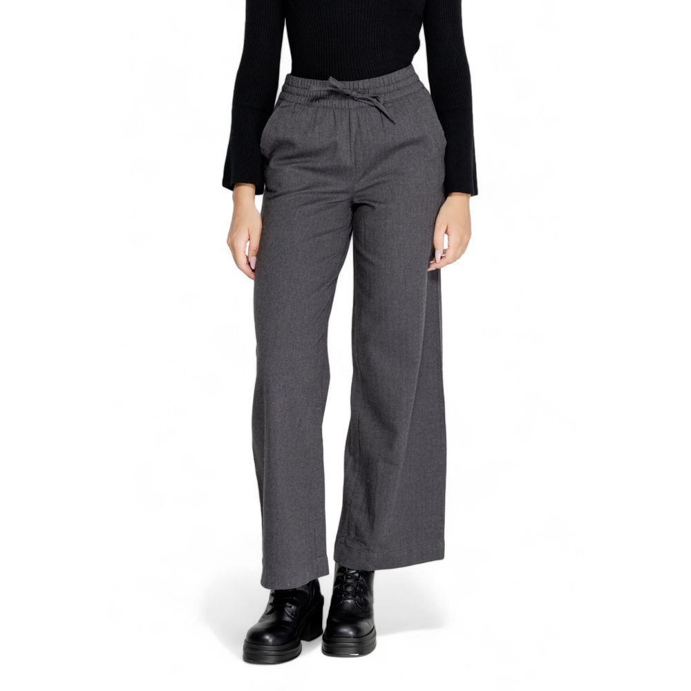 Woman wearing Jacqueline De Yong Gray Cotton Casual Pants with high elasticated waist and wide palazzo cut for comfortable elegance.