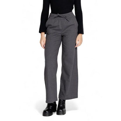 Woman wearing Jacqueline De Yong Gray Cotton Casual Pants with high elasticated waist and wide palazzo cut for comfortable elegance.