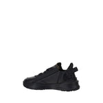 Side view of black Fendi Flow Running Sneakers with structured sole and press-engraved logo.