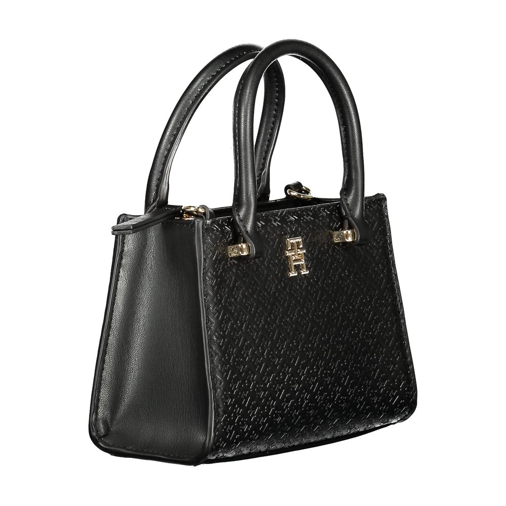 Front view with bag zipped and handles upright.