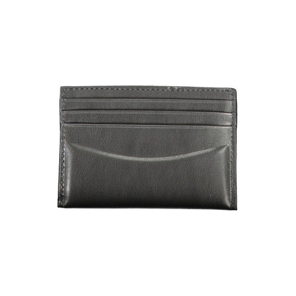 Calvin Klein Black Leather Wallet with card holder, double spaces, central pocket and logo.