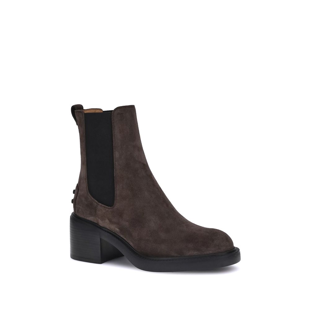 Tod's Brown Calf Leather Bos Taurus Ankle Boots with elastic sides and embossed monogram, featuring a rubber lug sole and block heel.