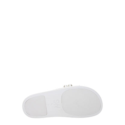 Underside view of Stuart Weitzman White Leather Slippers showing rubber sole and design details.