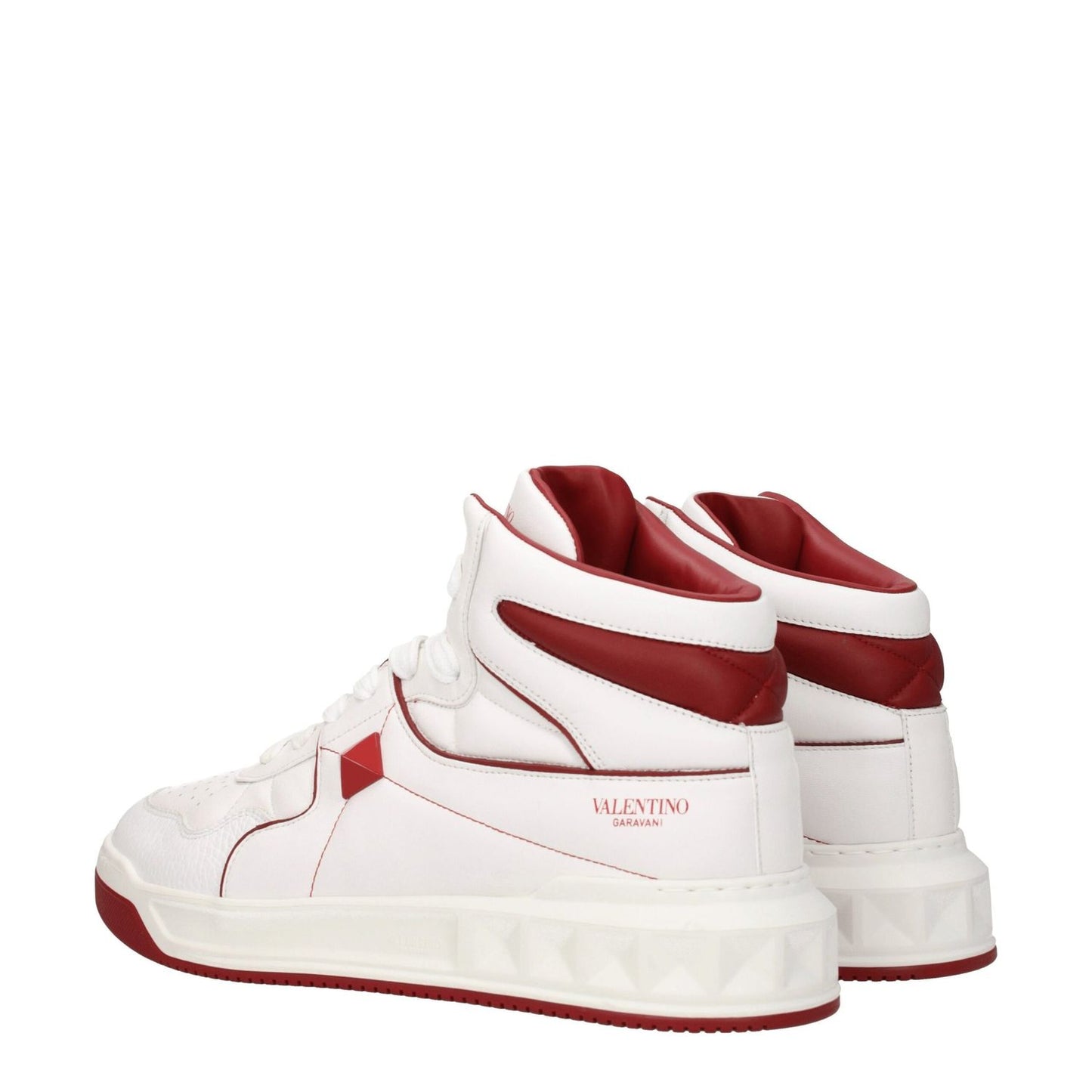 Valentino Garavani White Leather High Top Sneakers with studs, front and side logos, featuring mid heels and rubber sole.