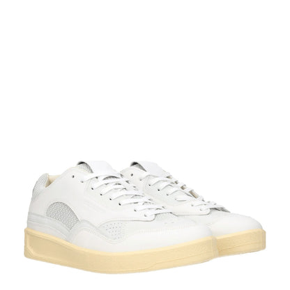 Jil Sander White Leather Low Top Sneakers with lace-up closure, round toe, mid heels, and light grey accents, sporty glam style.