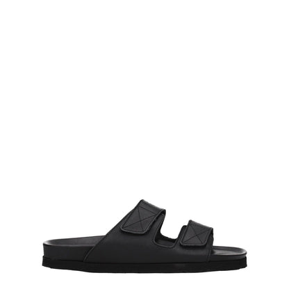 Side view of Palm Angels Black Leather Slippers with strap closure and open toe design, featuring a front logo and rubber sole.