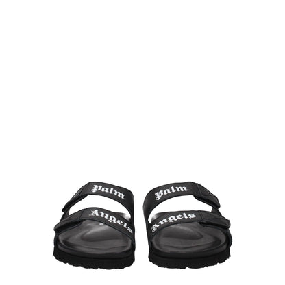 Palm Angels Black Leather Slippers with front logo, open toe, and rubber sole. Casual style with strap closure and low flat heel.