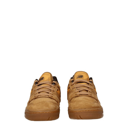 New Balance Brown Leather Sneakers in suede with round toe, rubber sole, and lace-up closure viewed from front.