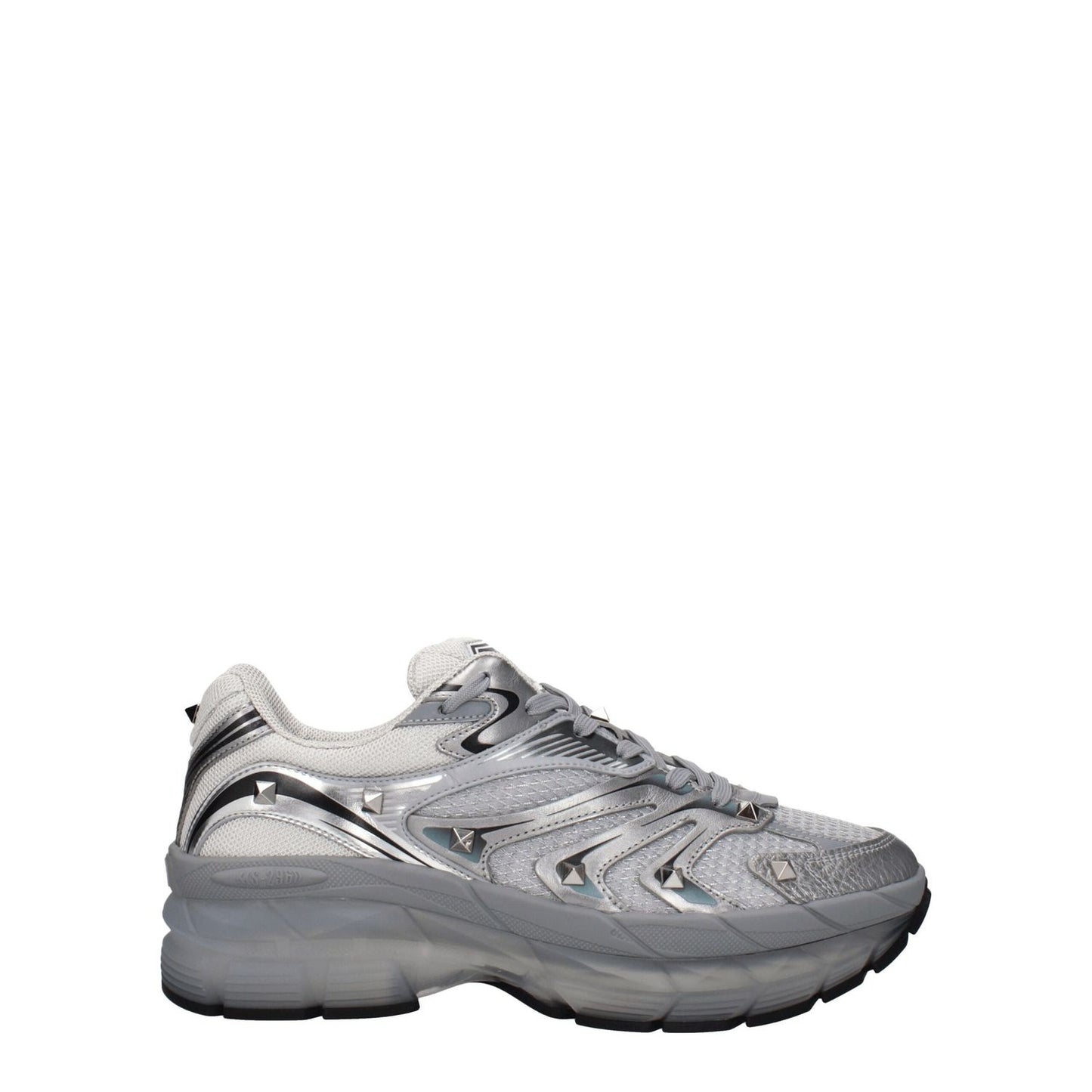 Valentino Garavani Gray Fabric Athletic Sneakers with studs and front logo, featuring lace-up closure and rubber sole, side view.