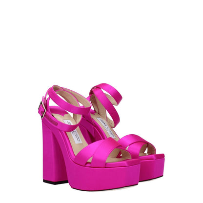 Jimmy Choo Pink Satin Platform Sandals with high heel and buckle closure, featuring a leather sole, open toe, and gold details.