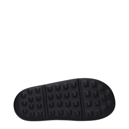 Sole view of Ambush Black Cotton Slippers featuring an open toe design and rubber sole with side logo.