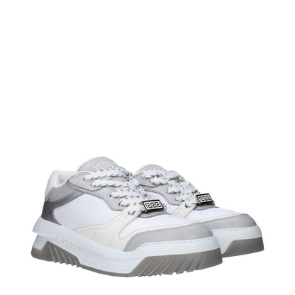 Versace White Leather Chunky Sneakers with logos and rubber sole, lace-up closure, mid heels, silver accents, round toe.