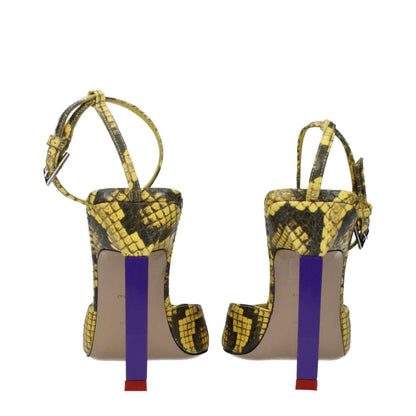 Back view of The Attico Yellow Leather Pumps with snake print, featuring high heels and buckle closure.