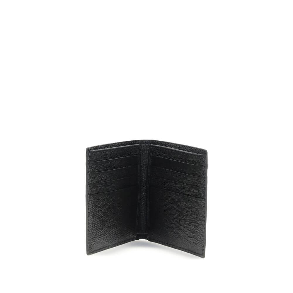 Valentino Garavani Black Calf Leather Bos Taurus Wallet with eight card slots and logo plaque, bifold design, elegant accessory