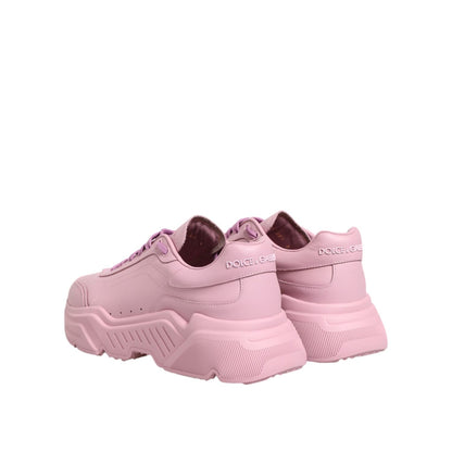 Dolce & Gabbana Pink Leather Daymaster Low Top Sneakers with lace-up closure and rubber sole, featuring logo details, made in Italy.