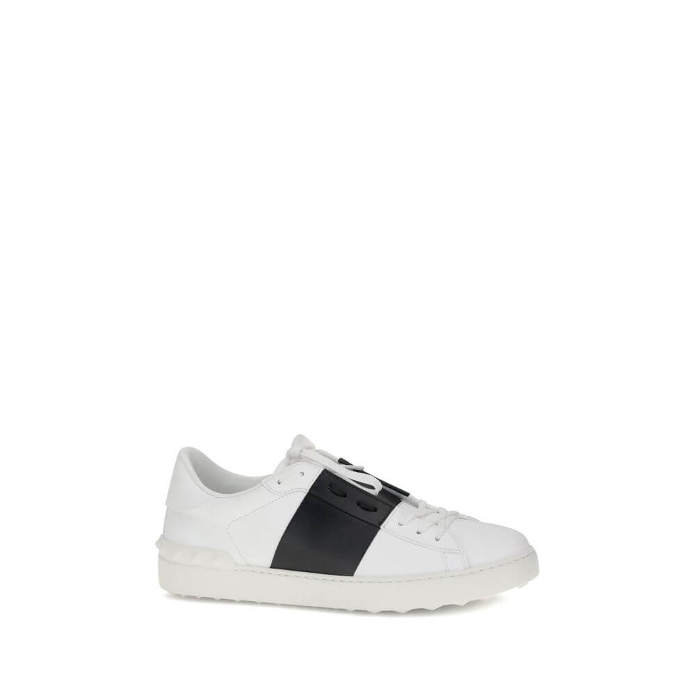 Valentino Garavani White Calf Leather Bos Taurus Low Top Sneakers with black side bands and studded heel detail.