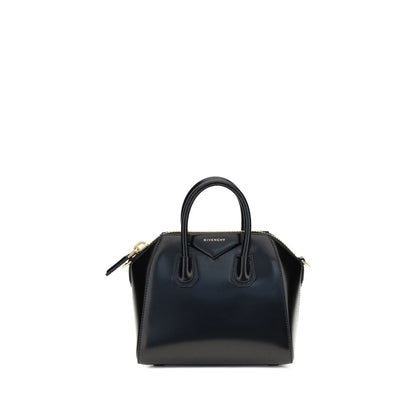 Givenchy Black Calf Leather Bos Taurus Handbag with glossy geometric design, top handles, zipper closure, and monogram on front.