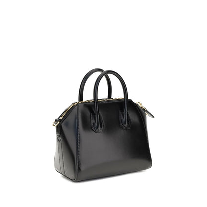 Givenchy Black Calf Leather Bos Taurus Handbag with geometric pattern, two top handles, and adjustable shoulder strap.