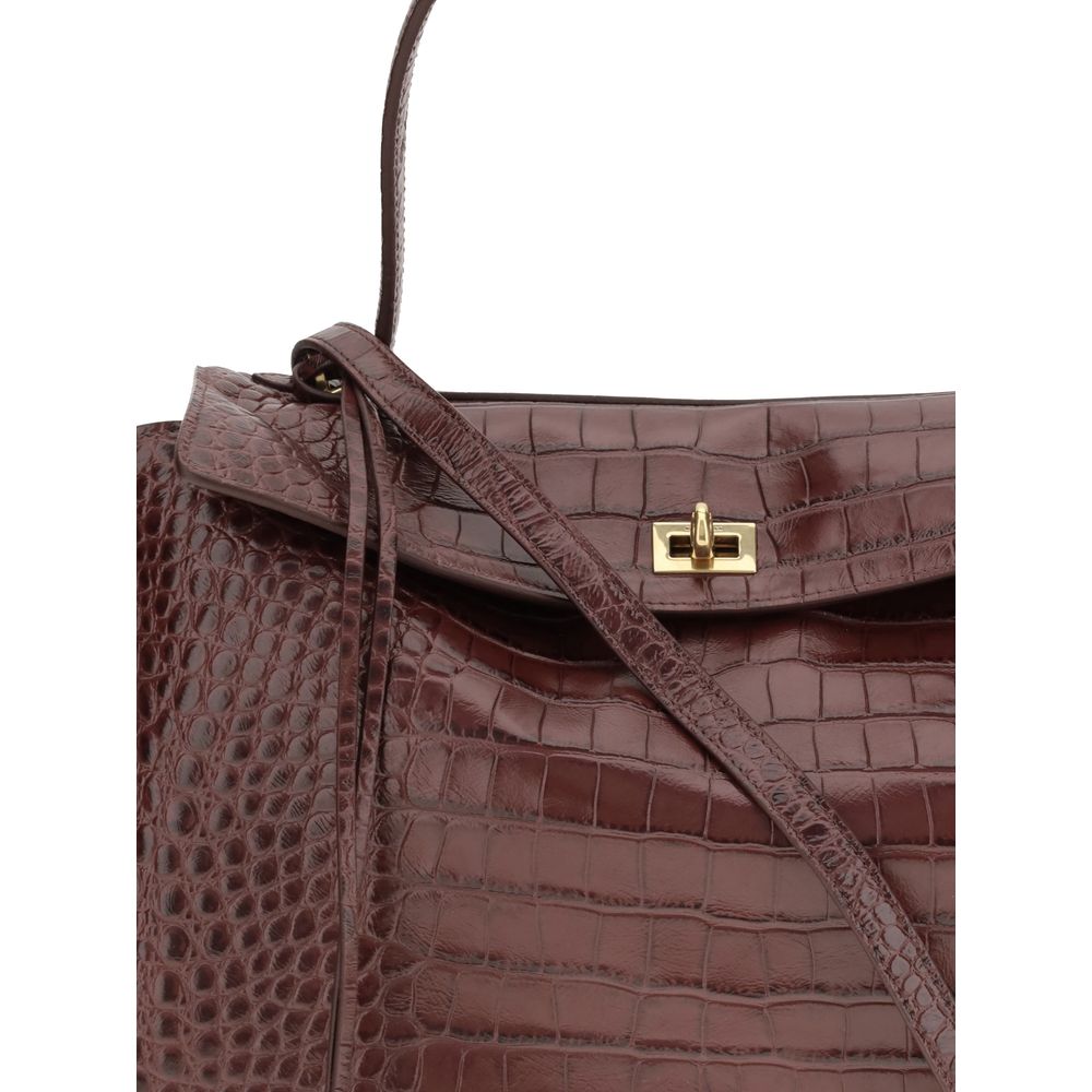 Balenciaga Brown Calf Leather Bos Taurus Handbag with crocodile-effect, flap closure, and charm key ring detail. Made in Italy.