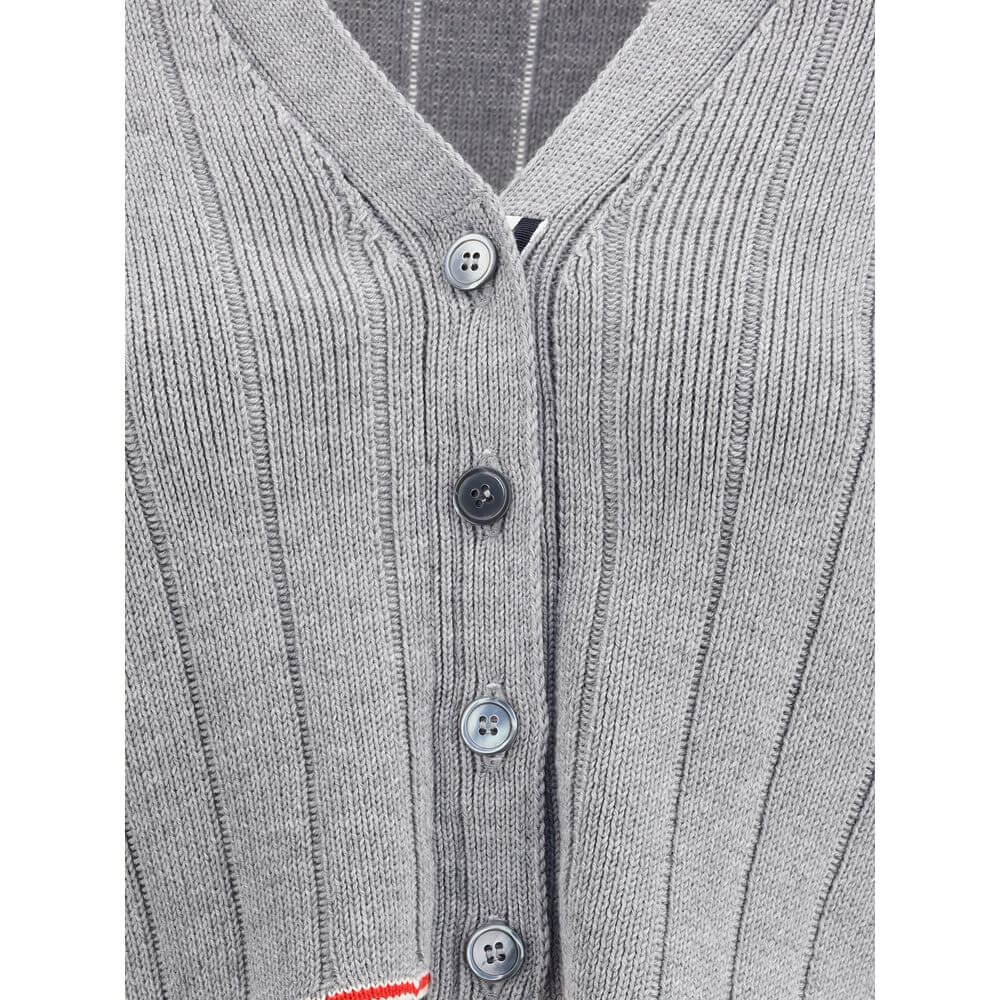 Close-up of Thom Browne Gray Fleece Wool Cardigan with button closure and ribbed design.