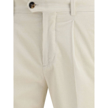 Close-up of Brunello Cucinelli Cream Cotton Two-Piece Suit pants featuring corduroy texture and button detail.