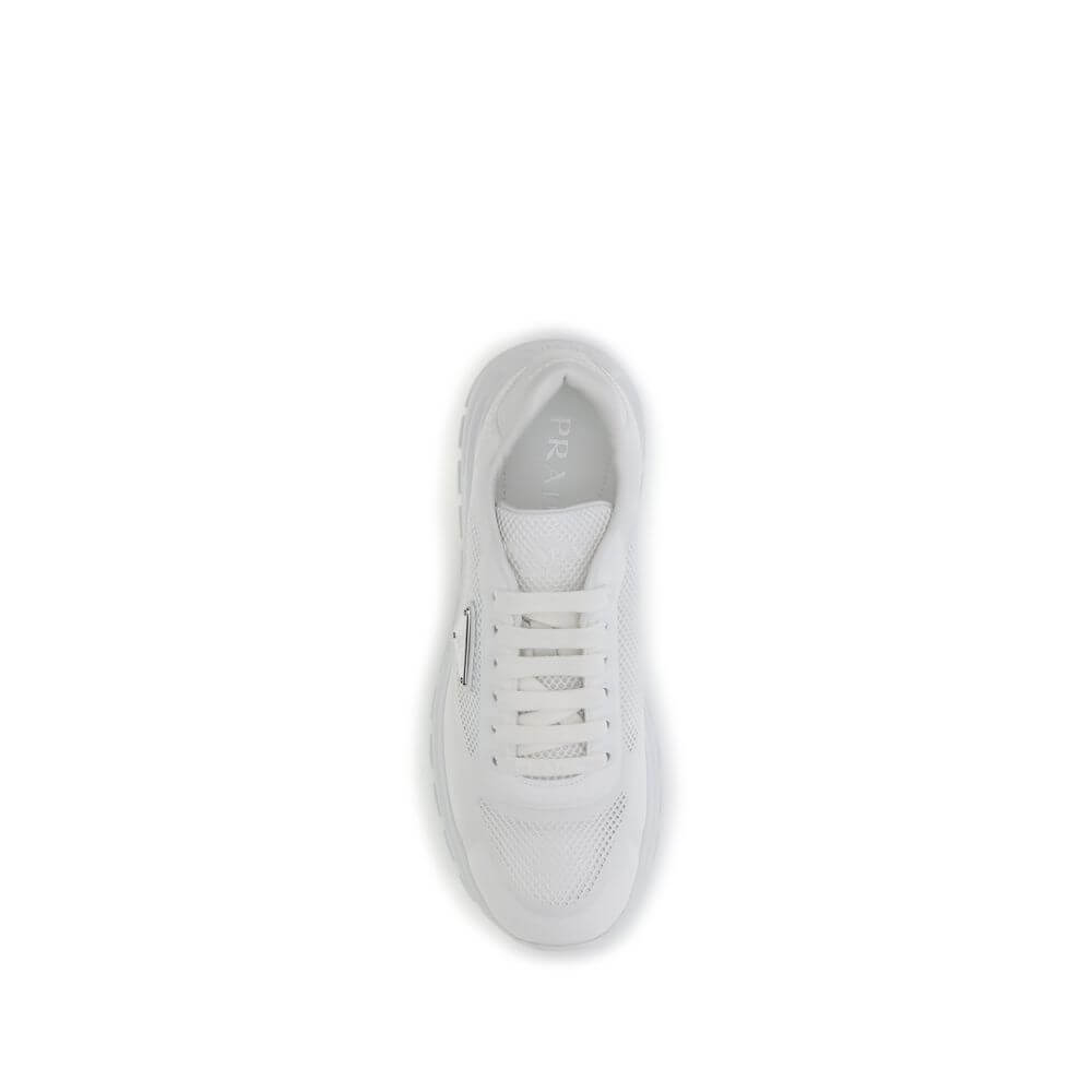 Top view of Prada White Rubber Athletic Sneakers with mesh and metal logo detail, featuring a secure lace-up closure for urban style.