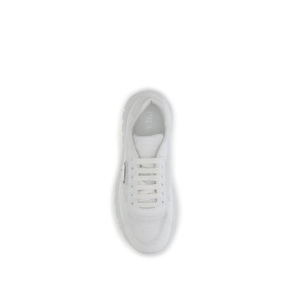 Top view of Prada White Rubber Athletic Sneakers with mesh and metal logo detail, featuring a secure lace-up closure for urban style.