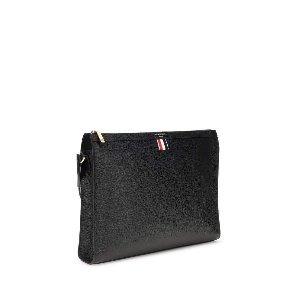 Thom Browne Black Calf Leather Bos Taurus Clutch Bag with tricolor detail and zipper closure.