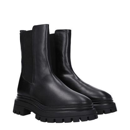 Stuart Weitzman Black Leather Ankle Boots with rubber sole, mid heel, and round toe. MPN: BEDFORDCHISC754BLACK. Style: Casual.