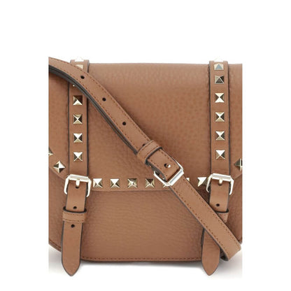 Valentino Garavani Beige Calf Leather Bos Taurus Shoulder Bag with iconic studs and adjustable strap, perfect for fashion-forward style.