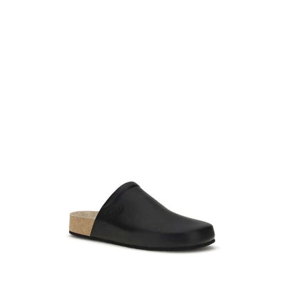Balenciaga Black Calf Leather Bos Taurus Mules with cork sole and logo-embossed insole, designed for comfort and modern style.
