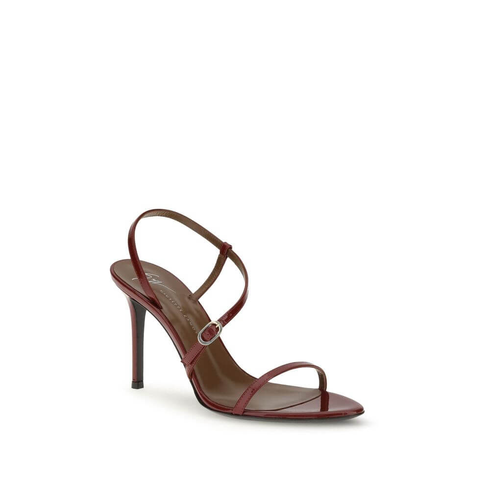 Giuseppe Zanotti Red Leather Stiletto Heel Sandals with thin straps and gold-tone buckles, ideal for elegant evenings.