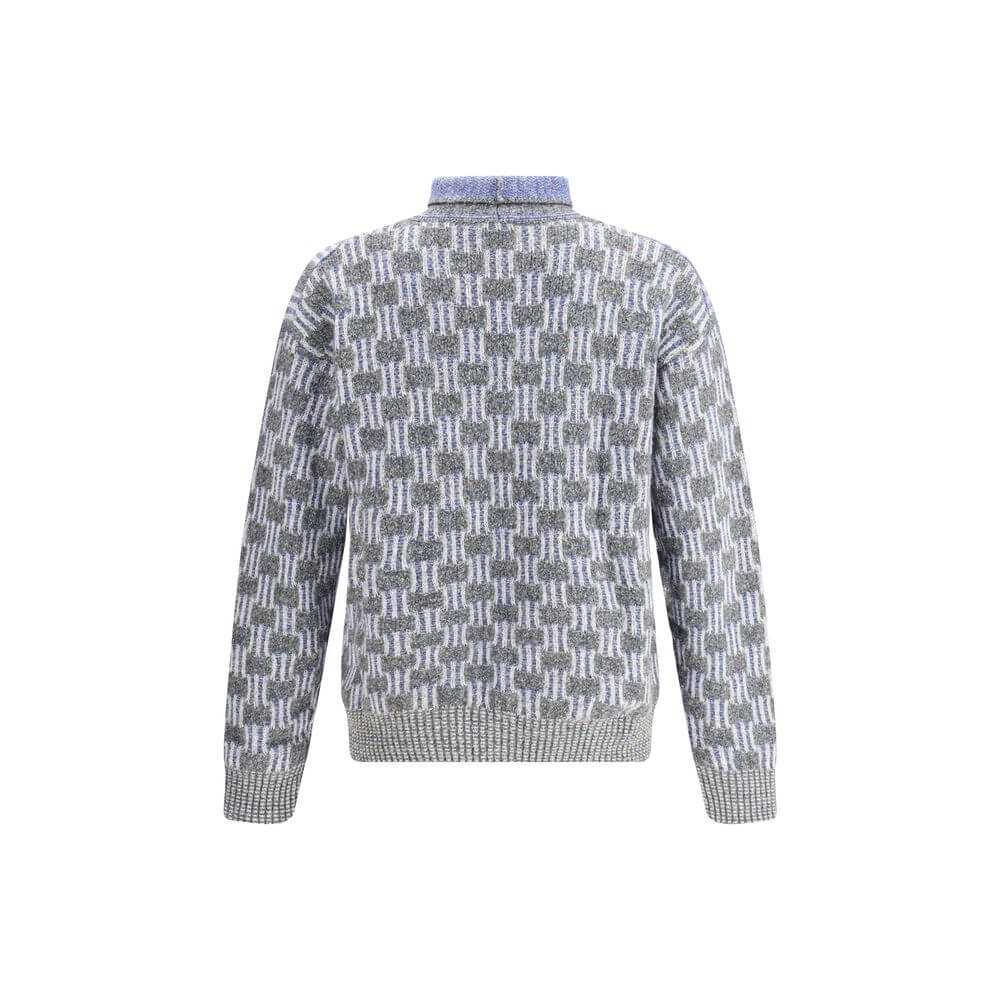 Giorgio Armani Light Blue Cotton Turtleneck with geometric pattern, made from cotton, alpaca wool, and cashmere blend for softness and warmth.