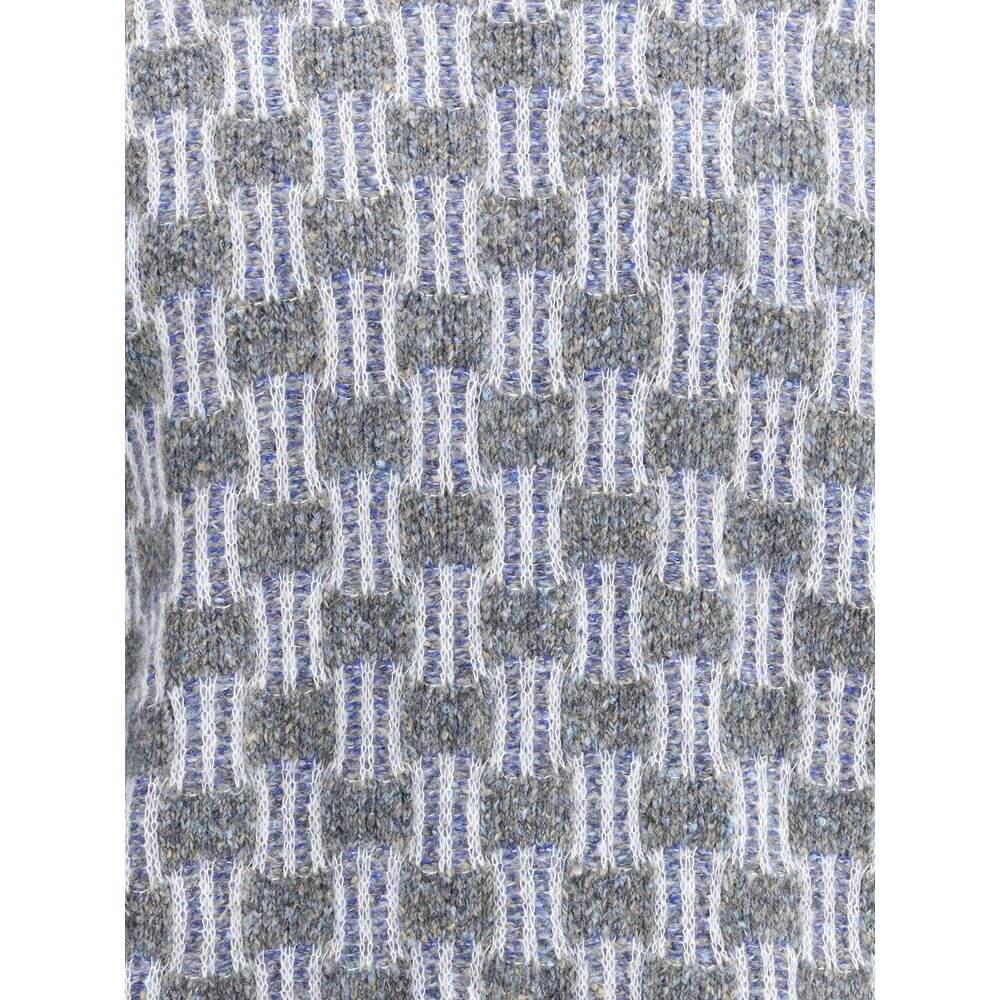 Close-up of Giorgio Armani Light Blue Cotton Turtleneck with two-tone graphic pattern knitting in fine cotton, alpaca wool, and cashmere.